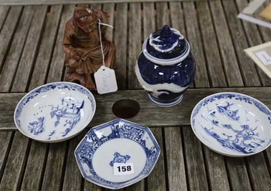 A pair of Chinese blue and white dishes and another, 18th century, a carved deity and a dragon vase